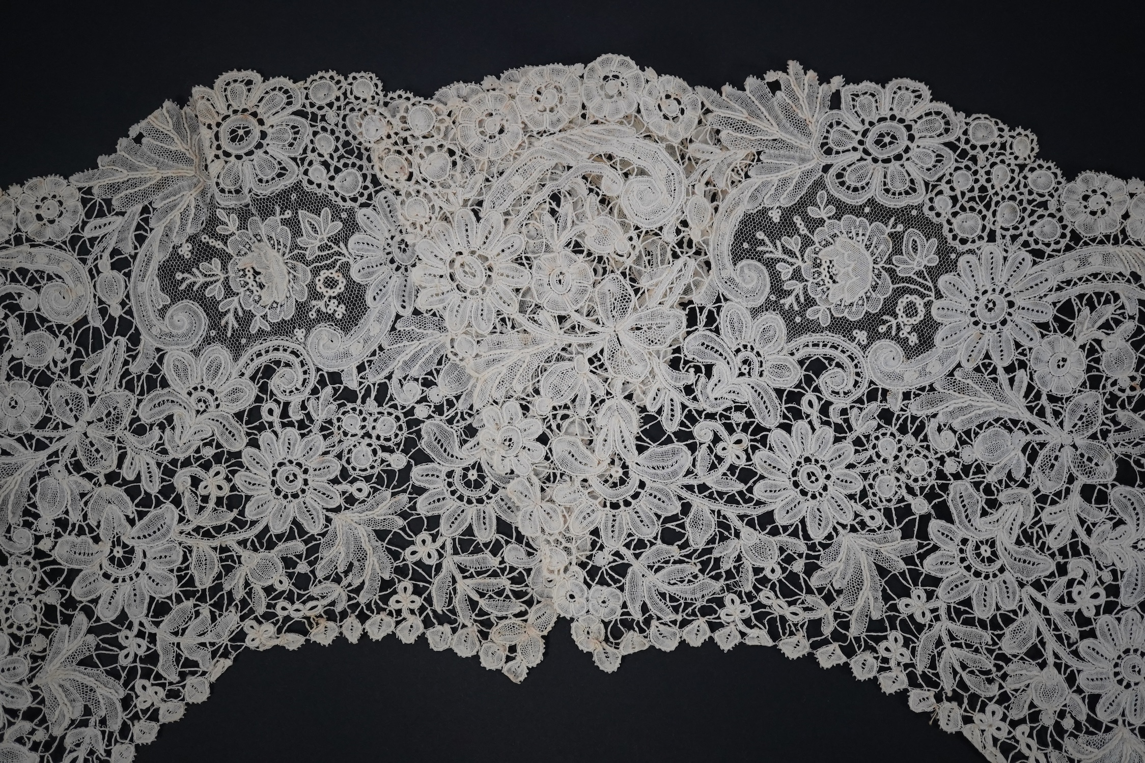 An 1860’s unused, large circular flounce shaped collar of mixed Brussels bobbin lace, with twelve needle lace Point de Gaz insertions, 18.5cm deep, approximately 248cm along bottom, edge. Condition - good